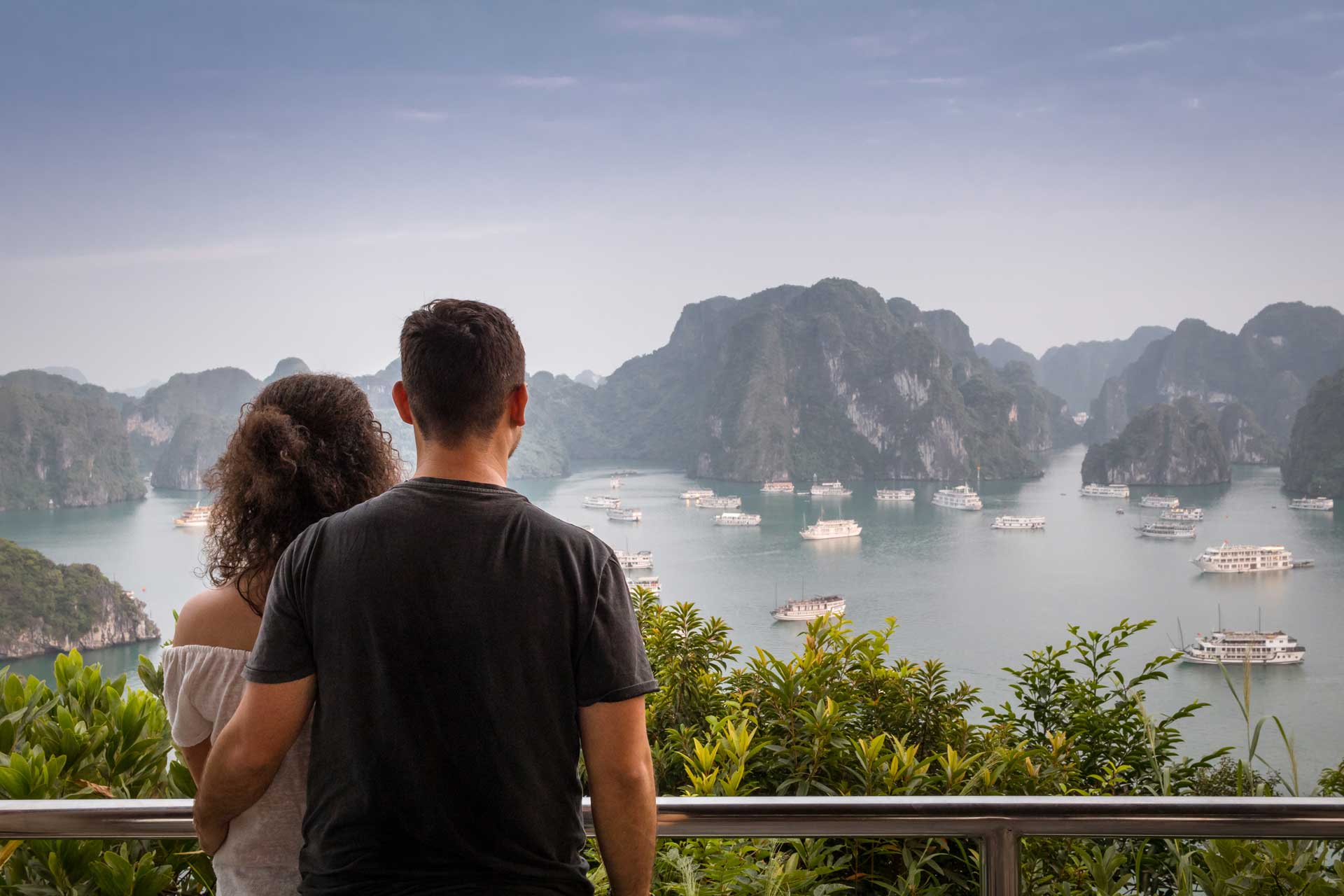 The couple admiring the stunning view of Ha Long Bay in Vietnam.